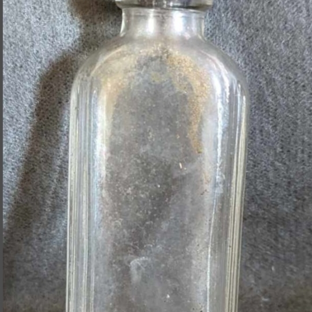 Vintage 1933 Clear Glass Medicine bottle with black screw cap